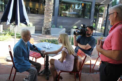 A picture of one of our veterans, Kavanaugh, being interviewed at the 2nd annual veterans luncheon